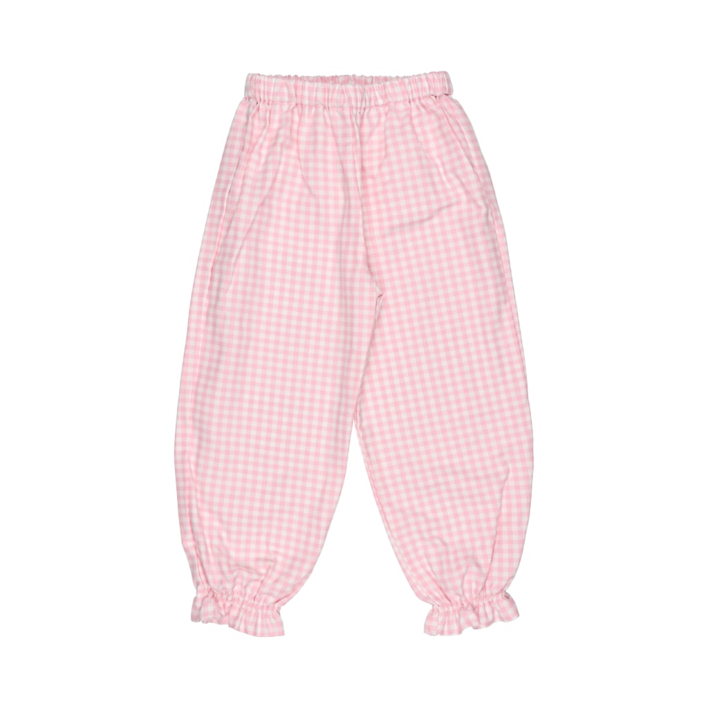 Calças de pijama para bebé rosa aos quadrados brancos. Têm um franzido no tornozelo.