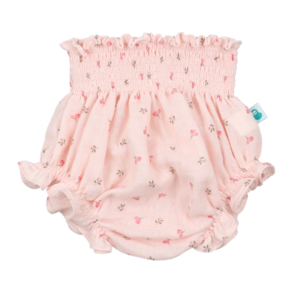 Tapa Fraldas de Bebé rosa com padrão estampado de flores.